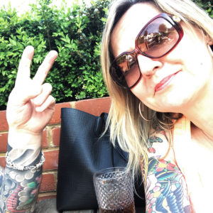 Picture of me, showing tattoos and wearing sunglasses